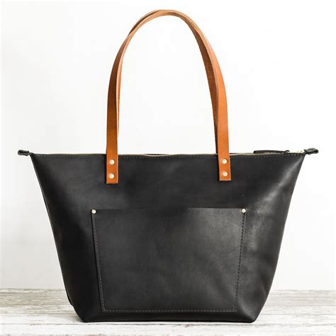 black leather tote with pockets